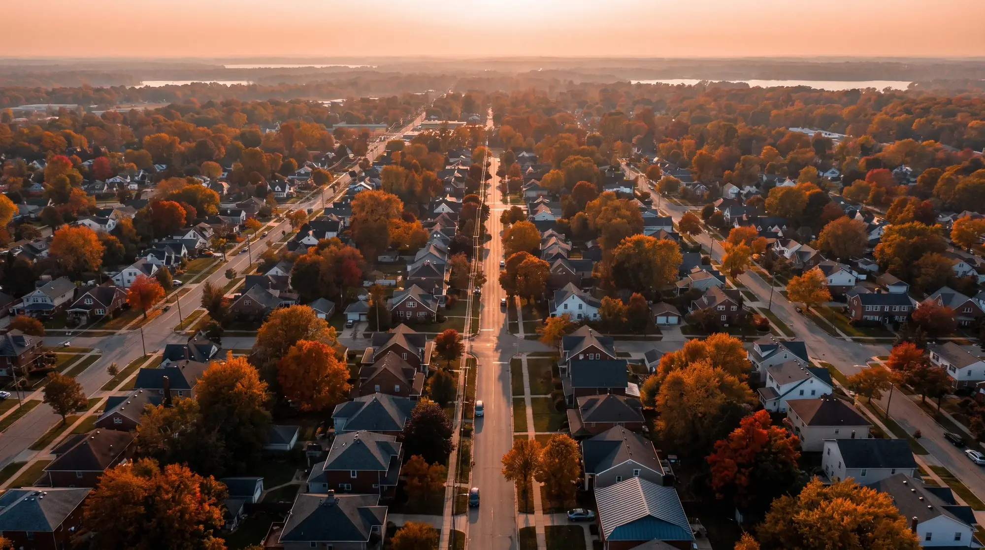 Rooftops across a Western New York neighborhood from above, illustrative