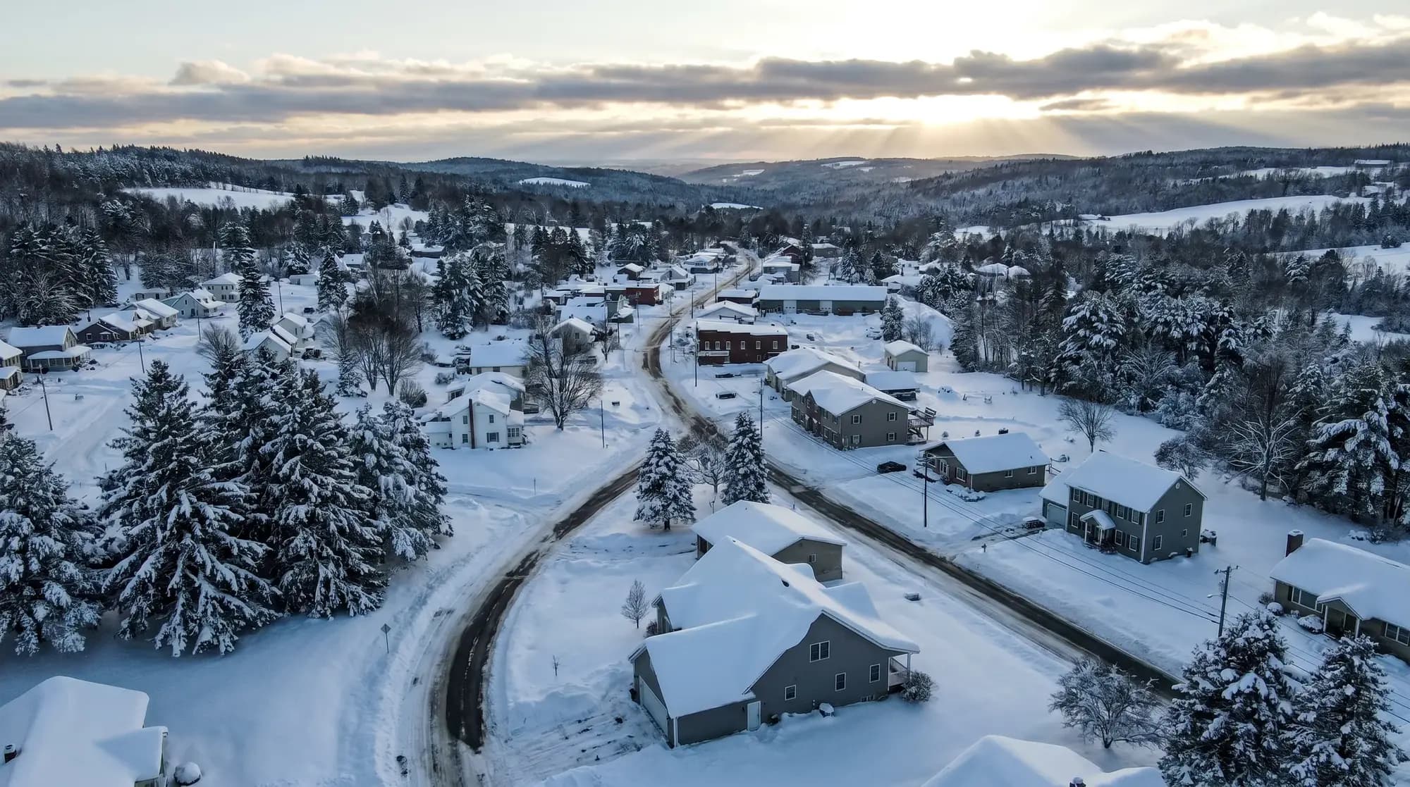 Snow-loaded rooftops across the Southtowns snowbelt, illustrative